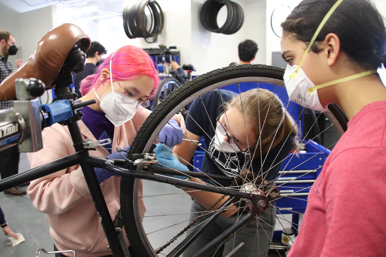 students building a bike